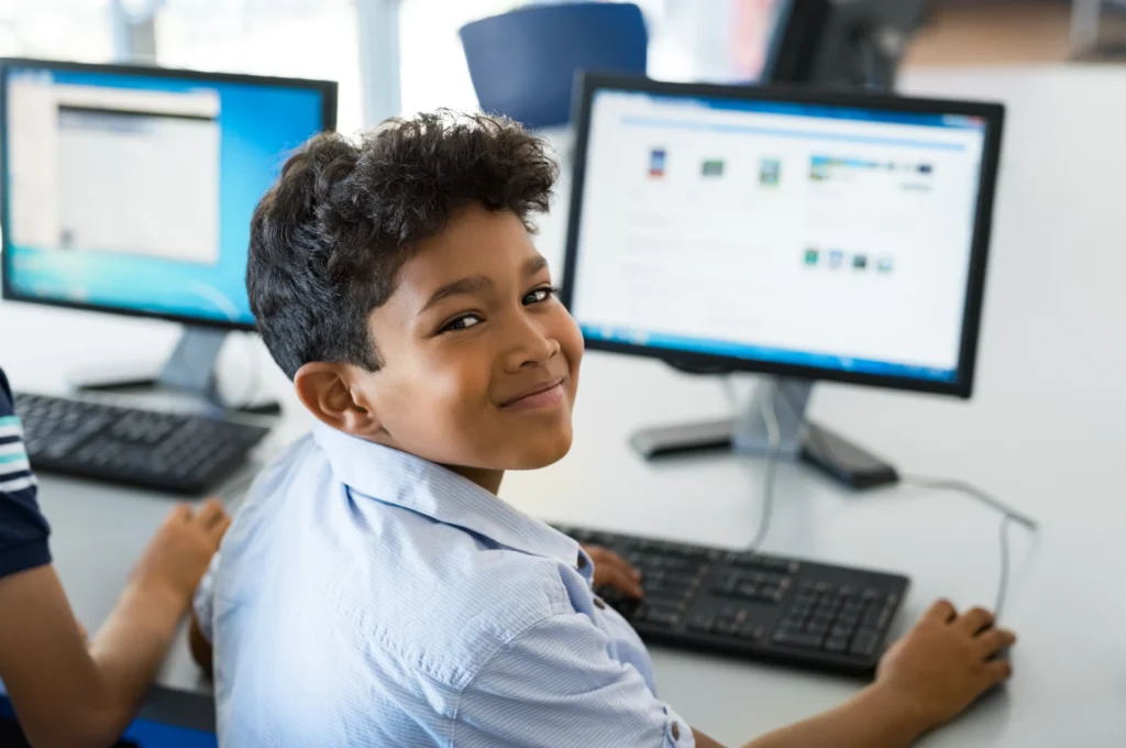 young boy learning using computer