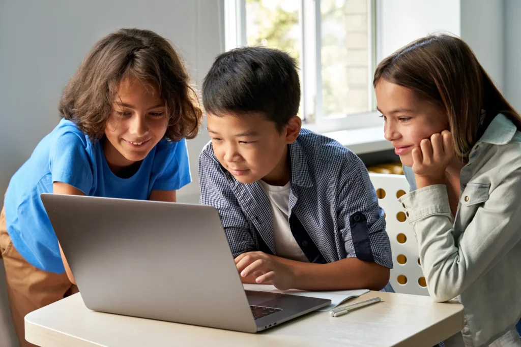 young children learning using laptop